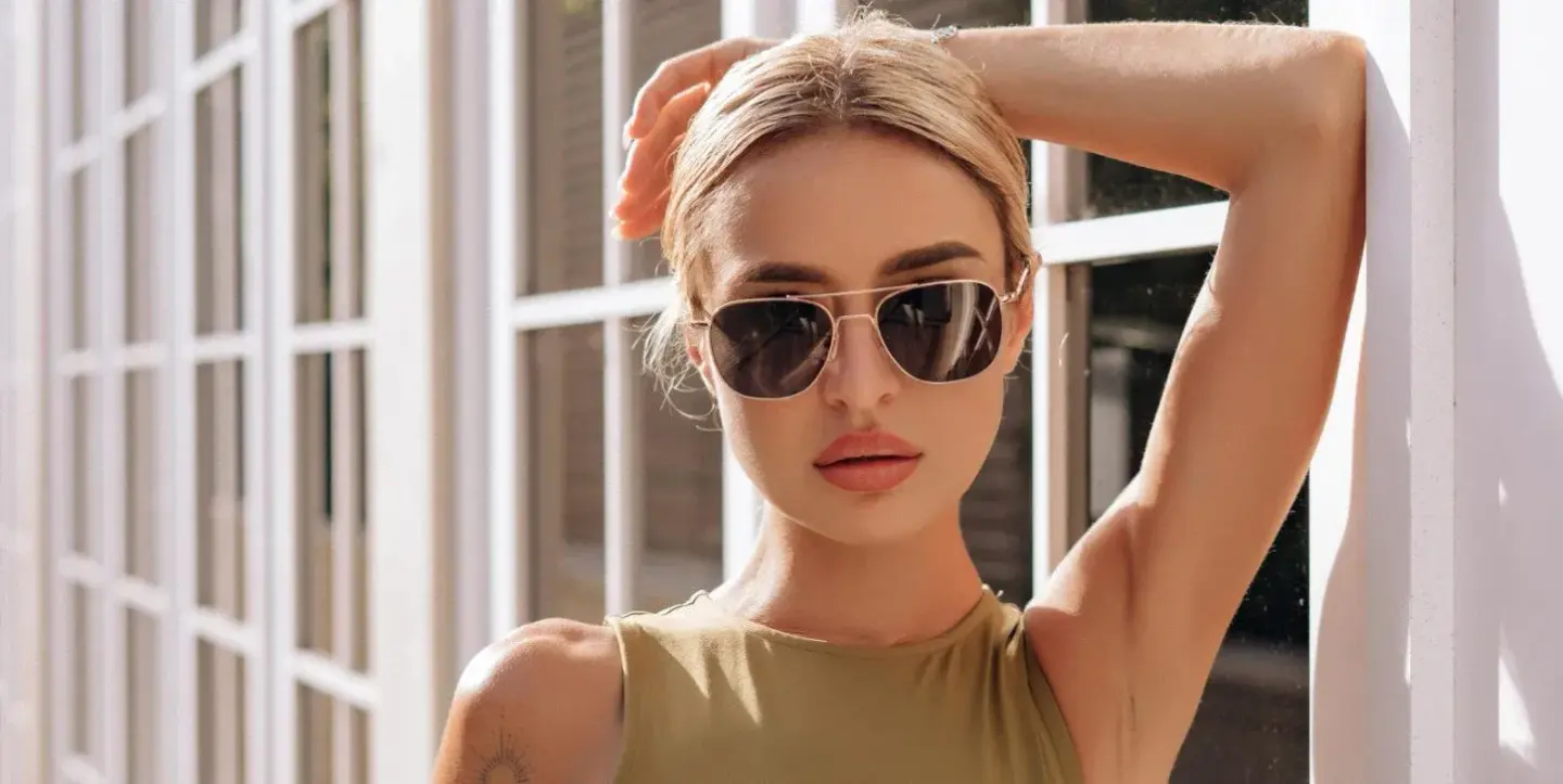 A girl wearing Aviator-shaped sunglasses sunglasses